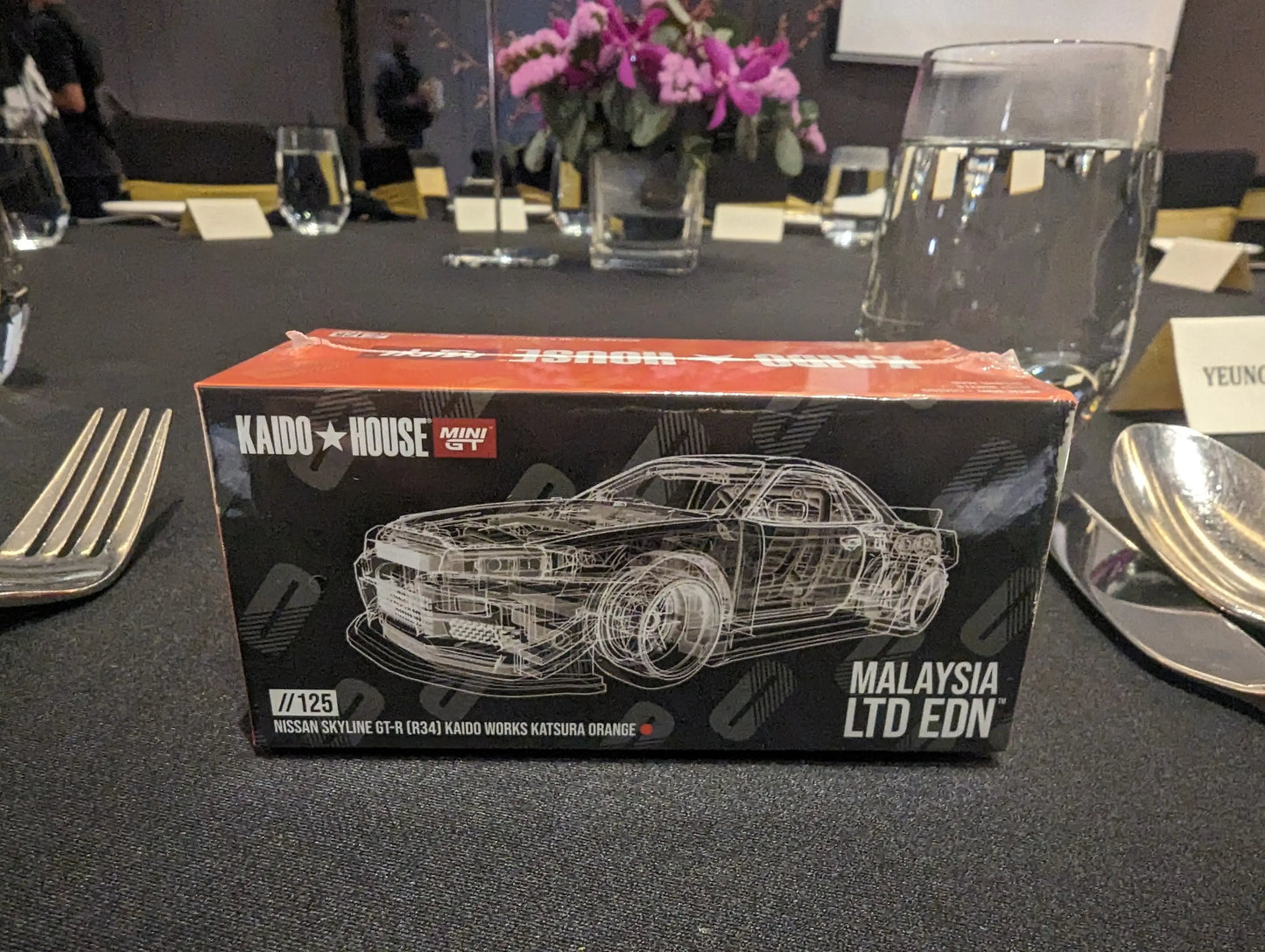 Mini GT Mini GT x Kaido House MDX 2024 #125 Nissan Skyline GT-R (R34) Kaido Works Katsura Orange LTD EDN