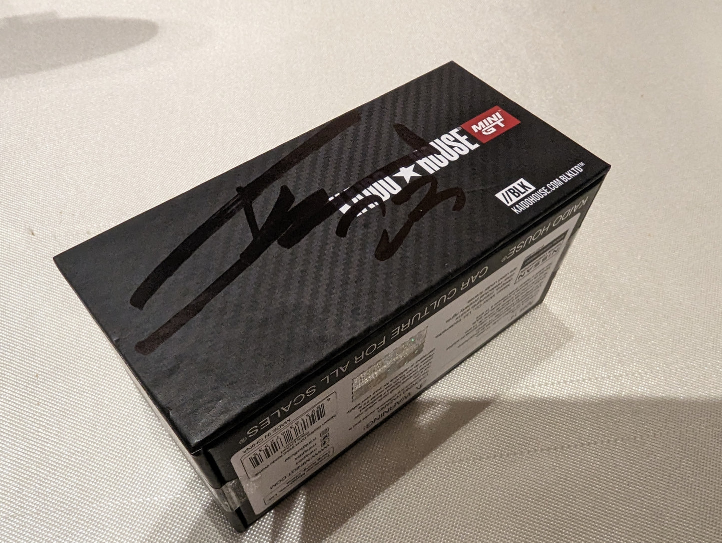 Mini GT x Kaido House MDX23 Nissan Skyline GT-R R34 BLKLTD With Pin