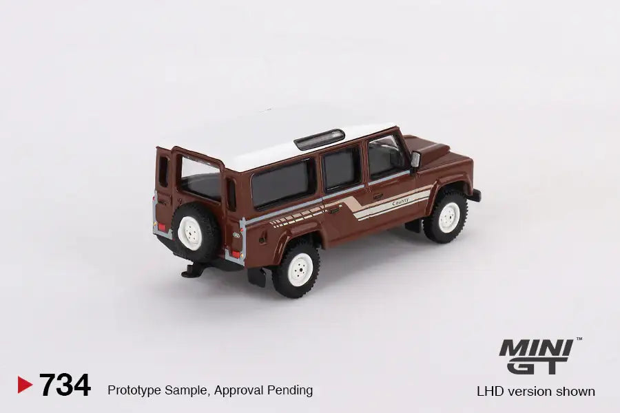 Mini GT Mini GT #734 Land Rover Defender 110 1985 County Station Wagon Russet Brown