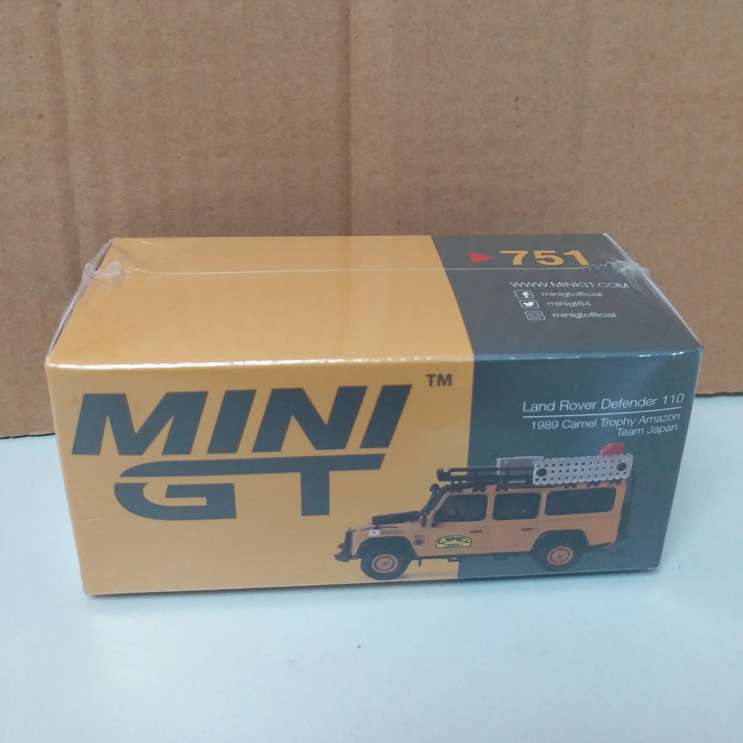 Mini GT Mini GT #751 Land Rover Defender 110 1989 Camel Trophy Amazon Team Japan