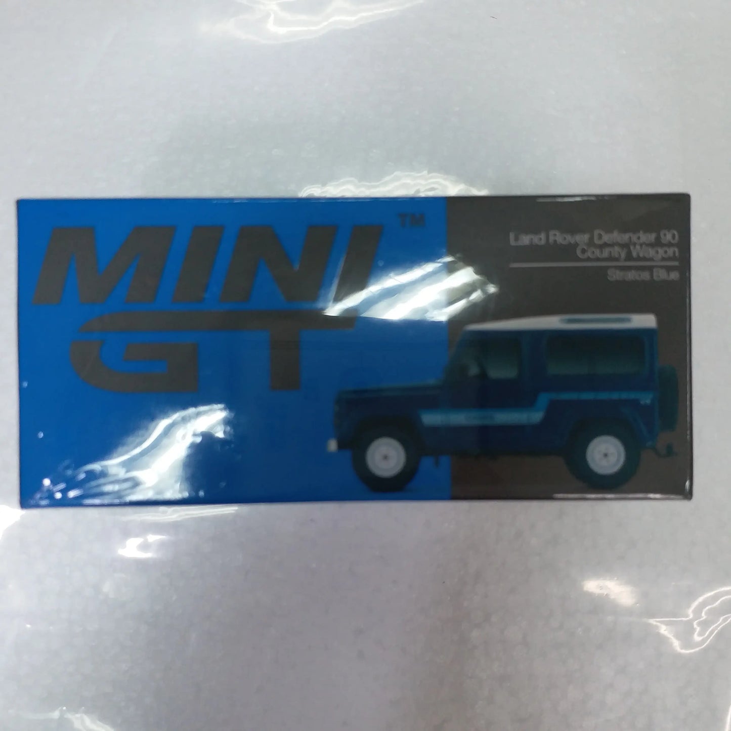Mini GT Mini GT #353 1/64 Land Rover Defender 90 County Wagon Stratos Blue