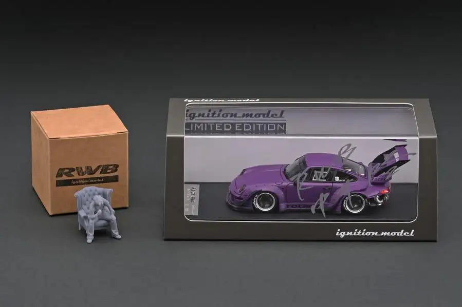 Ignition Model 1:43 Scale IG online shop/event special! IG2322 RWB 993 Rotana Matte Purple With Mr. Nakai sitting on sofa
