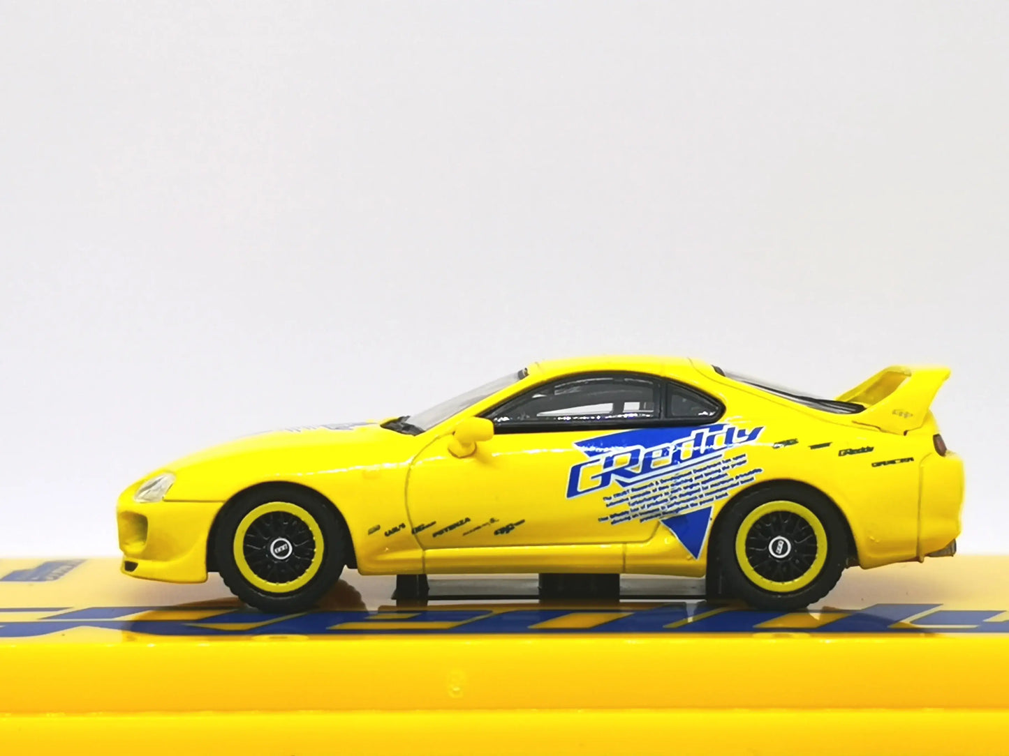 Tarmac Works 1:64 Scale Toyota Supra (JZA80) GReddy