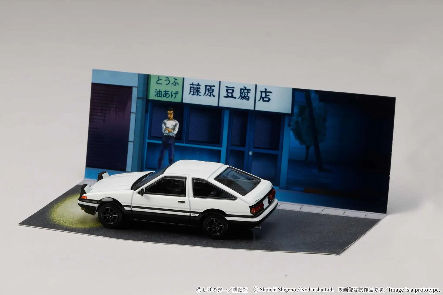Hobby Japan 1:64 Toyota Sprinter Trueno AE86 model in display case.