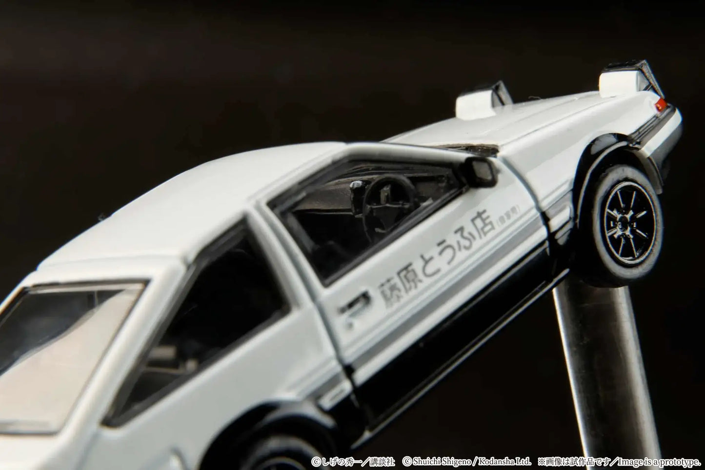 Hobby Japan 1:64 Toyota Sprinter Trueno AE86 model with racing decals.