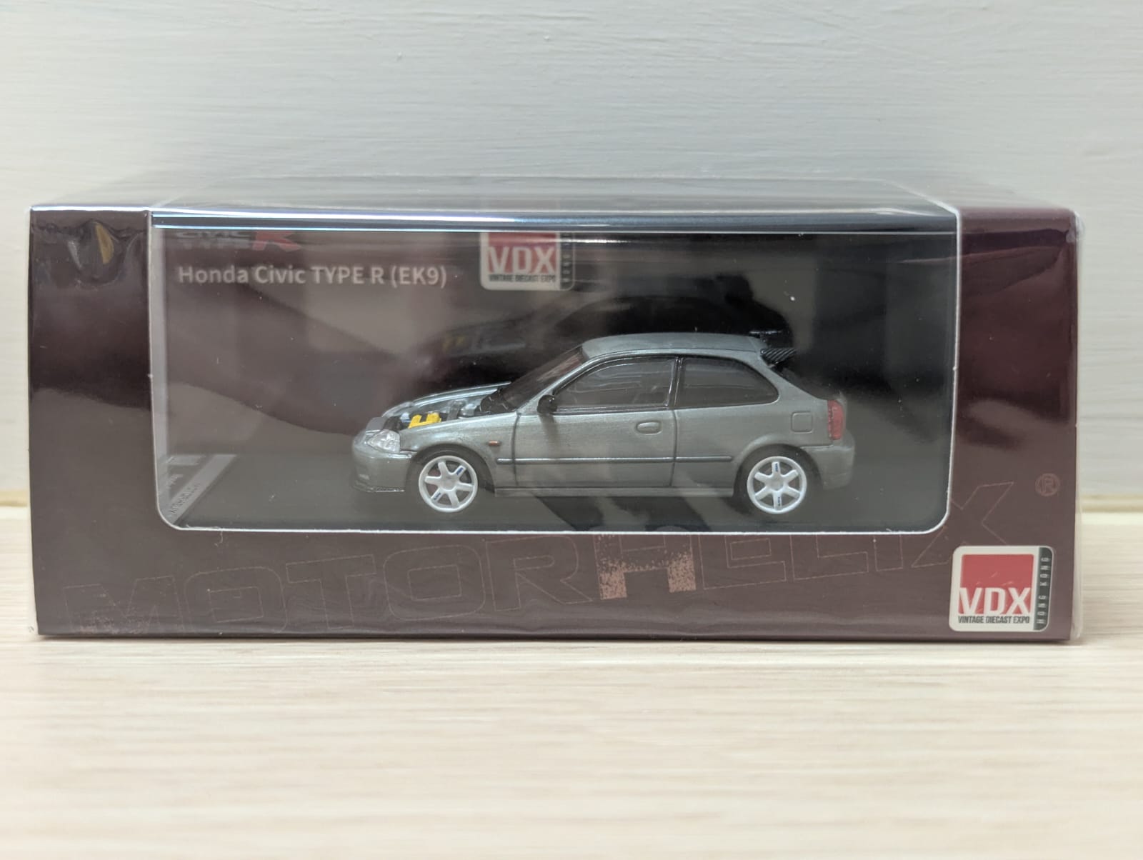 Model car in packaging with VDX branding on a neutral background