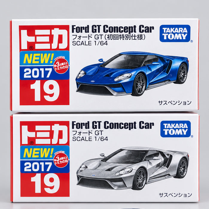 Two boxes of Takara Tomy Tomica Ford GT Concept Car scale 1/64 model kits stacked vertically on a light surface against a brown cardboard background.