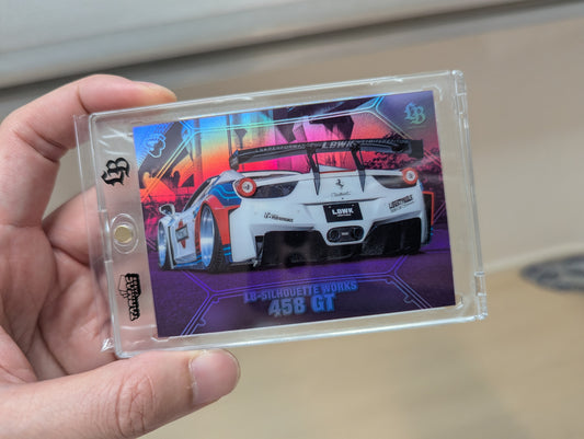 Hand holding a collectible card with a car design on a plain background